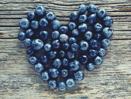blueberries on wooden surfaceの写真素材