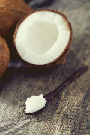 coconut oil on wooden surfaceの写真素材