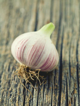 fresh garlic on wooden surfaceの写真素材