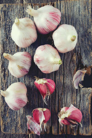 fresh garlic on wooden surfaceの写真素材