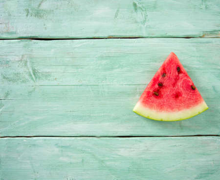 freshly cut water melon on wooden tableの写真素材