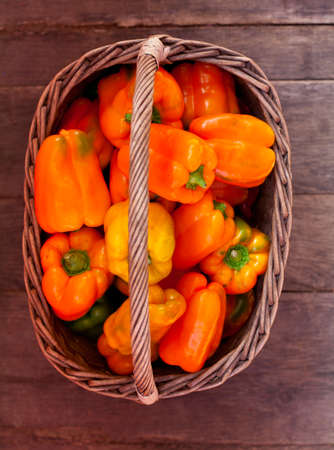 orange paprika in basketの写真素材
