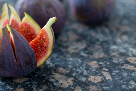 fresh figs on stone backgroundの写真素材