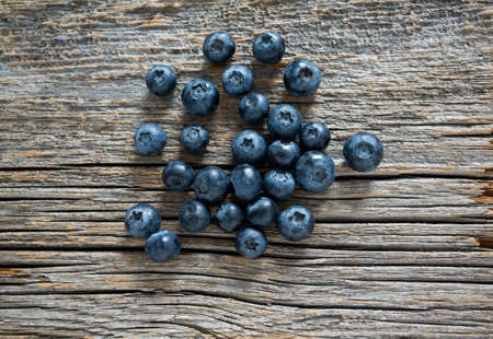 blueberries on wooden surfaceの写真素材