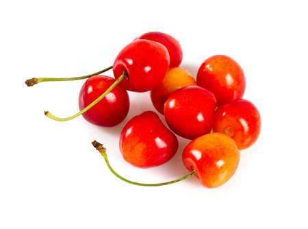 yellow and pink cherries isolated on white