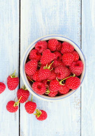 raspberry on wooden surface