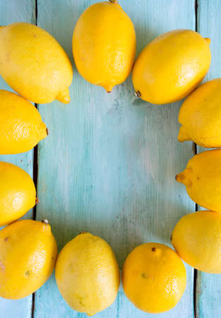 lemons on turquoise wooden backrgoundの写真素材