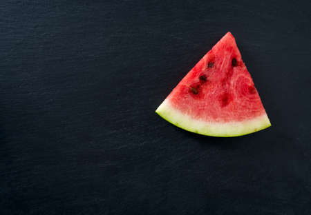 freshly cut water melon on chalkboard