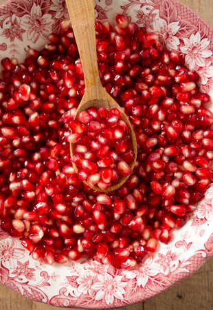 pomegranate seeds in a bowlの写真素材