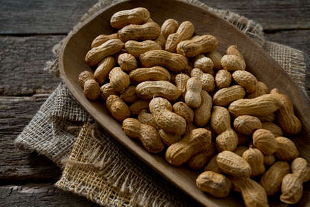 peanuts on wooden surface