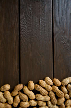 peanuts on wooden surface