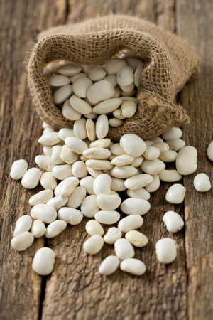 white butter beans on wooden surface