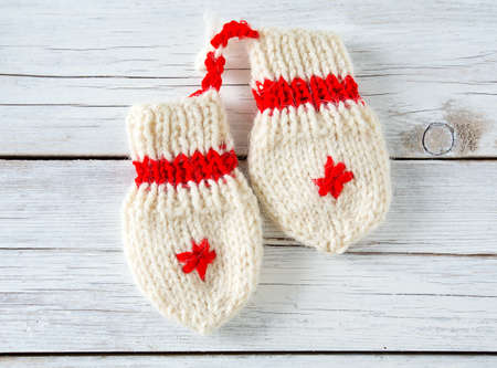 knitted baby socks and mittensの写真素材