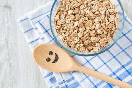 spelt flakes on wooden surface