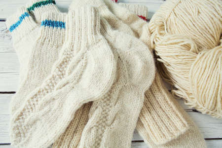 knitted clothes on wooden surfaceの写真素材