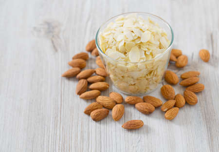 sliced almonds on wooden surfaceの写真素材