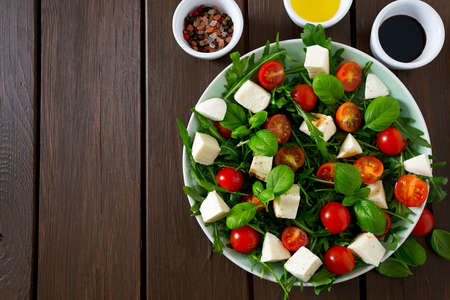 Vegetarian salad with cherry tomato, mozzarella and rucolaの写真素材
