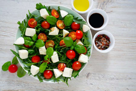 Vegetarian salad with cherry tomato, mozzarella and rucolaの写真素材