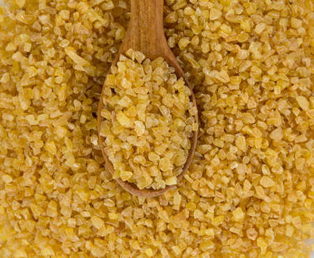 bulgur cereal isolated on whiteの写真素材