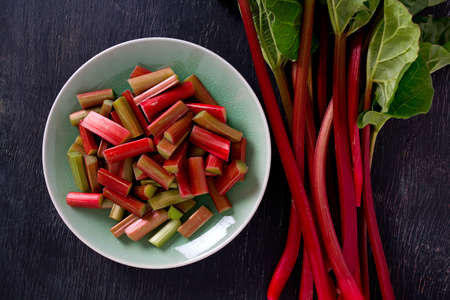 rhubarb pieces on dark wooden surface