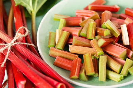 pieces of rhubarb on turquoise wooden surface