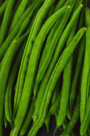 string beans on dark stone backgroundの写真素材