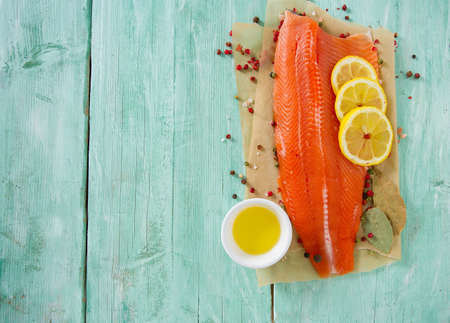 fresh trout fillet on wooden surfaceの写真素材