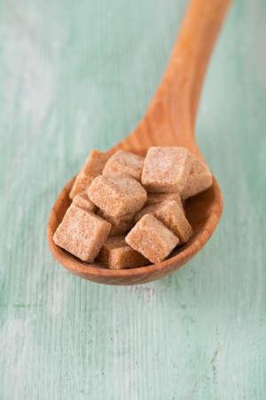 brown sugar on trquoise backgroundの写真素材