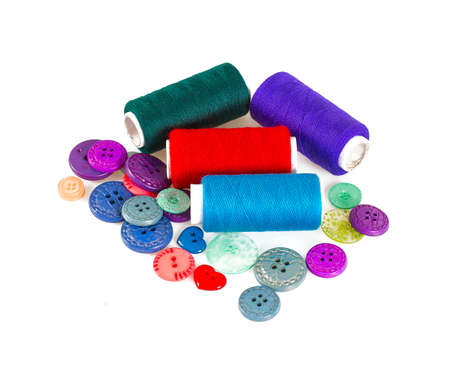 Sewing buttons and thread isolated on white