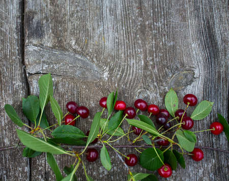 cherry on wooden surfaceの写真素材