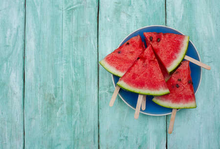 watermelon pops for a picnic on turquoise background