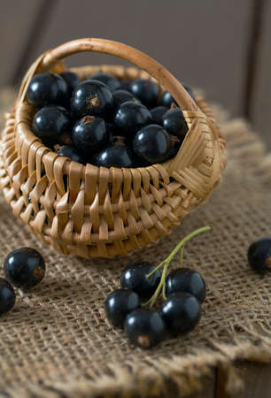 black currant on wooden surfaceの写真素材