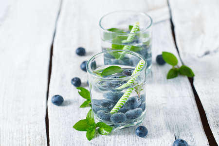 Infused water with mint and blueberriesの写真素材