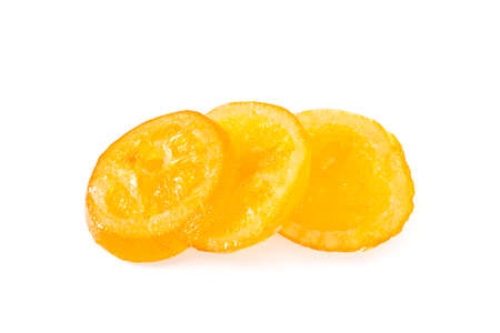 dried orange slices with sugar isolated on whiteの写真素材