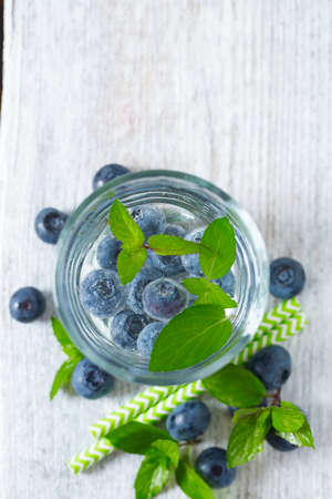 Infused water with mint and blueberriesの写真素材