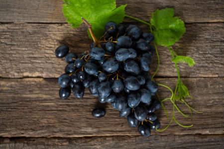 grapes on rustic wooden surface