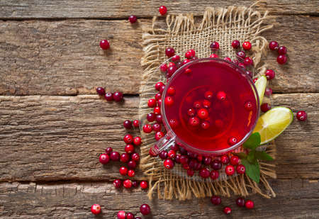 cranberry tea on wooden surfaceの写真素材