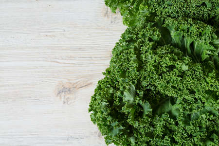 kale on white wooden surfaceの写真素材