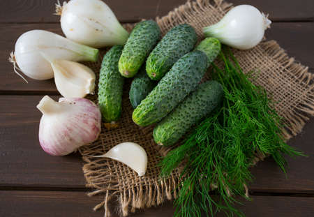 cucumber harvest on wooden surfaceの写真素材