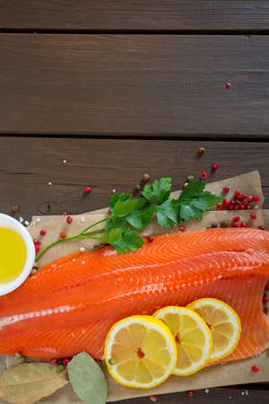 fresh trout fillet on wooden surface