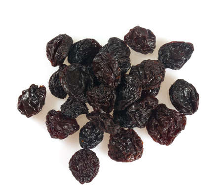 black raisins isolated on whiteの写真素材