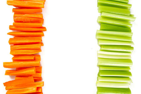 carrot and celery sticks isolated on whiteの写真素材