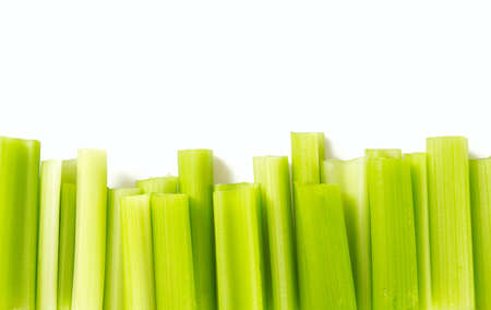 celery sticks isolated on whiteの写真素材