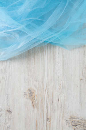 blue fabric on white wooden surfaceの写真素材