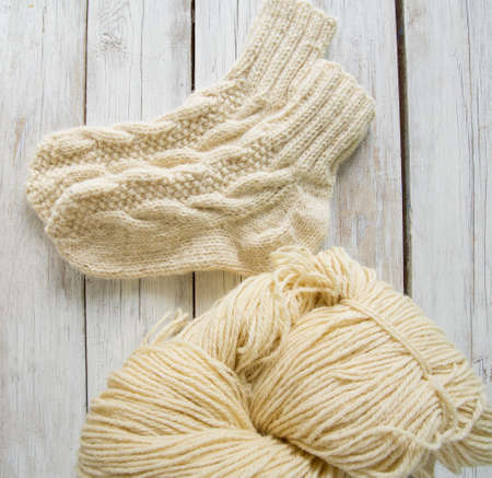 knitted socks on wooden surfaceの写真素材