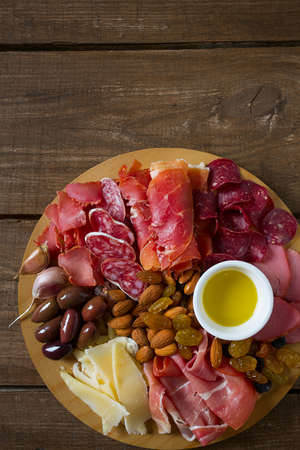 antipasti platter on wooden surface