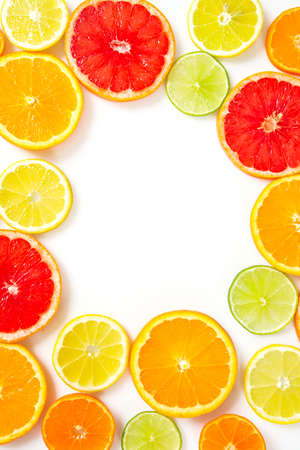 citrus fruit slices isolated on whiteの写真素材
