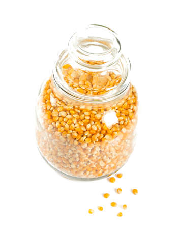 jar of dried corn isolated on white backgroundの写真素材