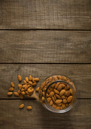 almonds on wooden surfaceの写真素材