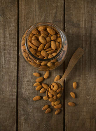 almonds on wooden surfaceの写真素材